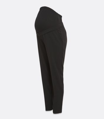 Click to view product details and reviews for Maternity Black Stretch Over Bump Trousers New Look.