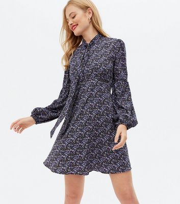 Click to view product details and reviews for Blue Vanilla Blue Ditsy Floral Tie Neck Mini Swing Dress New Look.