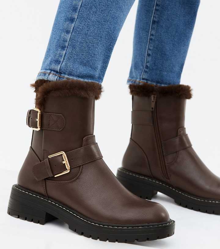 black boots with brown trim