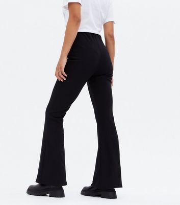Click to view product details and reviews for Black Ribbed Flared Trousers New Look.