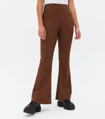 Click to view product details and reviews for Rust Ribbed Flared Trousers New Look.