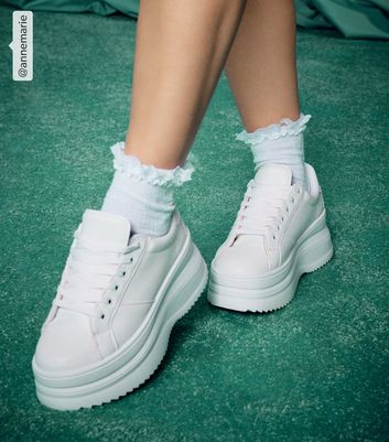 Chunky white store platform trainers