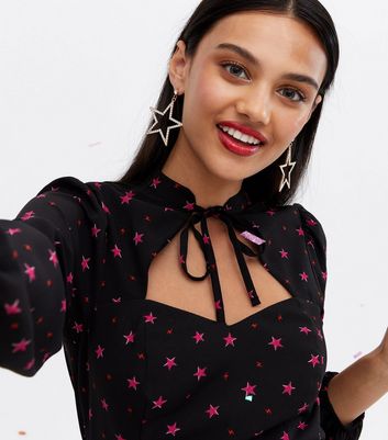 Click to view product details and reviews for Black Star Tie High Neck Cut Out Mini Dress New Look.