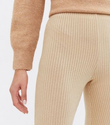 Click to view product details and reviews for Stone Ribbed Jersey High Waist Flared Trousers New Look.