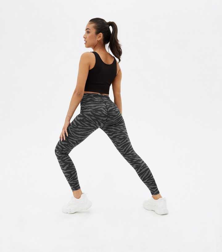 https://media2.newlookassets.com/i/newlook/810203209M3/womens/clothing/leggings/petite-black-zebra-print-high-waist-sports-leggings.jpg?strip=true&qlt=50&w=720
