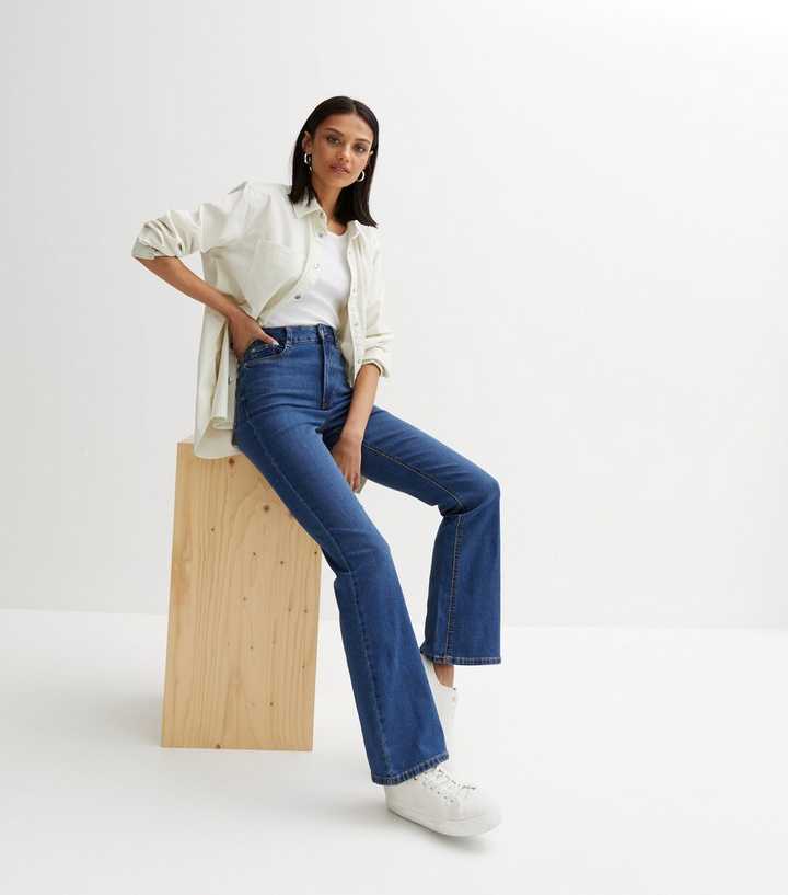 https://media2.newlookassets.com/i/newlook/810771440/womens/clothing/jeans/blue-waist-enhance-quinn-bootcut-jeans.jpg?strip=true&qlt=50&w=720