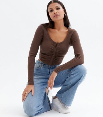 Click to view product details and reviews for Dark Brown Ribbed Ruched Button Front Long Sleeve Crop Top New Look.