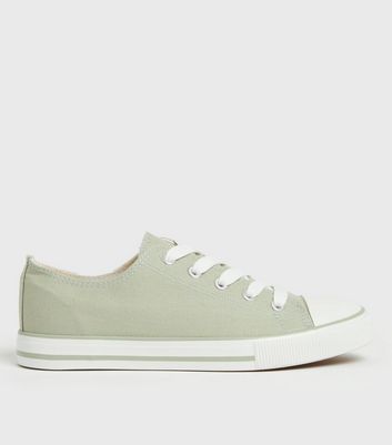 green canvas trainers