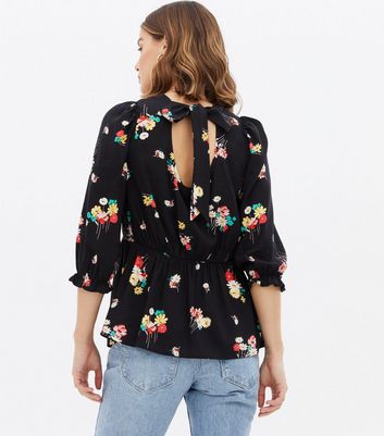 Click to view product details and reviews for Maternity Black Floral Tie Back Peplum Blouse New Look.