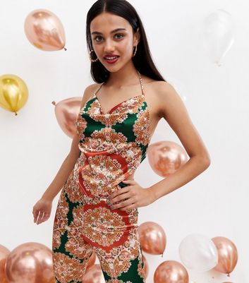 Click to view product details and reviews for Multicoloured Paisley Satin Hanky Hem Halter Top New Look.