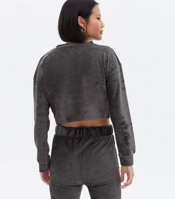 Click to view product details and reviews for Pink Vanilla Grey Velvet Logo Crop Sweatshirt New Look.