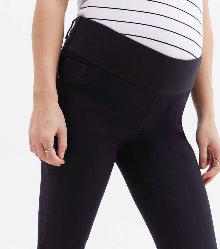 https://media2.newlookassets.com/i/newlook/813623001M2/womens/clothing/jeans/tall-maternity-black-under-bump-lift-shape-emilee-jeggings.jpg?strip=true&qlt=50&w=720