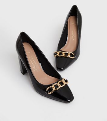 Black and store gold court heels