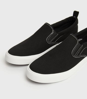 Black canvas slip on trainers hotsell