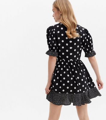 Click to view product details and reviews for Black Spot Frill Mini Wrap Dress New Look.