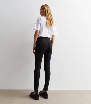 womens black mid rise skinny jeans