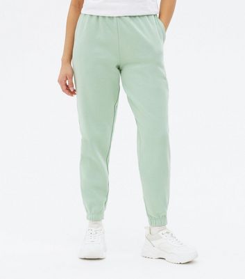 Click to view product details and reviews for Petite Light Green Jersey Cuffed Joggers New Look.