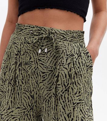 Click to view product details and reviews for Khaki Animal Print Tie Waist Joggers New Look.
