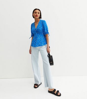 Click to view product details and reviews for Blue Ditsy Floral Tie Front Peplum Blouse New Look.