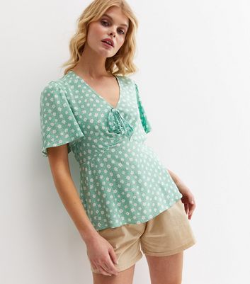 Click to view product details and reviews for Green Ditsy Floral Tie Front Peplum Blouse New Look.