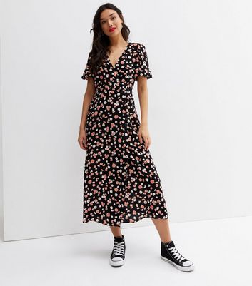 Click to view product details and reviews for Black Floral Button Side Midi Wrap Dress New Look.