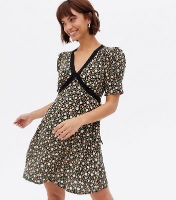 Click to view product details and reviews for Black Ditsy Floral Lace Trim Mini Tea Dress New Look.