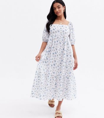 Click to view product details and reviews for Petite White Ditsy Floral Tiered Tie Back Midi Dress New Look.