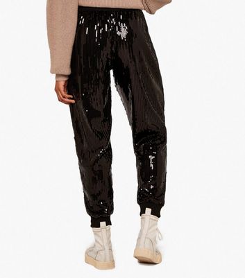 Click to view product details and reviews for Apricot Black Sequin Joggers New Look.