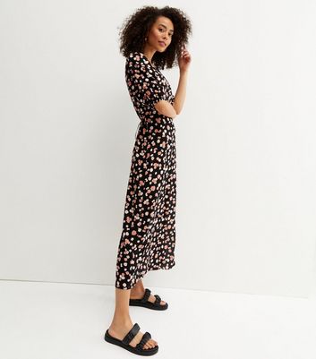 Click to view product details and reviews for Tall Black Floral Button Side Midi Wrap Dress New Look.