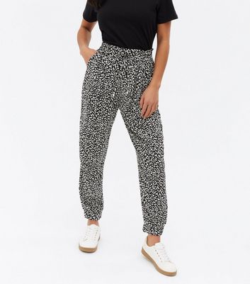 Click to view product details and reviews for Petite Black Animal Print Tie Waist Joggers New Look.