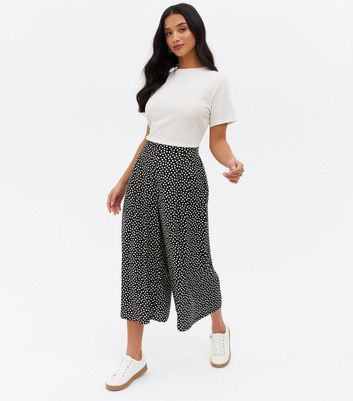 Click to view product details and reviews for Petite Black Spot High Waist Crop Wide Leg Trousers New Look.