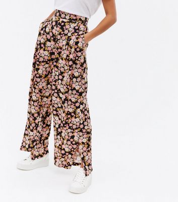 Click to view product details and reviews for Petite Black Floral Split Hem Wide Leg Trousers New Look.