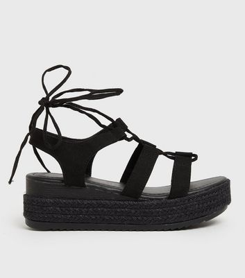 ASOS DESIGN Faithful leather toe loop tie up sandal in black | ASOS