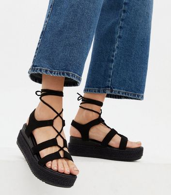 black platform tie sandals