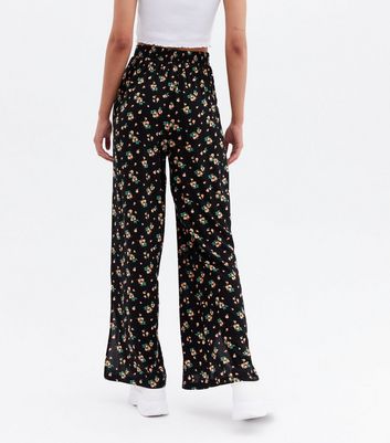 Click to view product details and reviews for Black Peaches Split Hem Flared Trousers New Look.