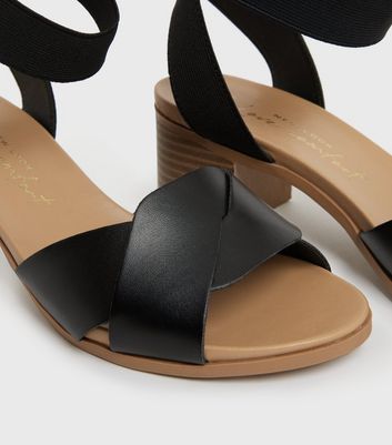 Click to view product details and reviews for Wide Fit Black Twist Strap Block Heel Sandals New Look Vegan.