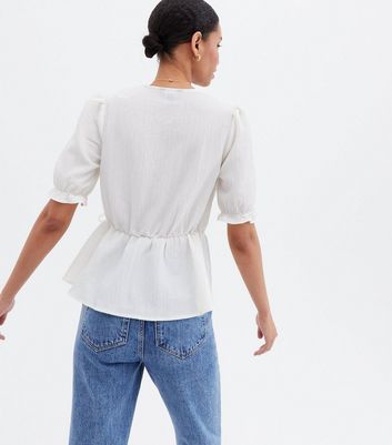 White Textured V Neck Peplum Wrap 