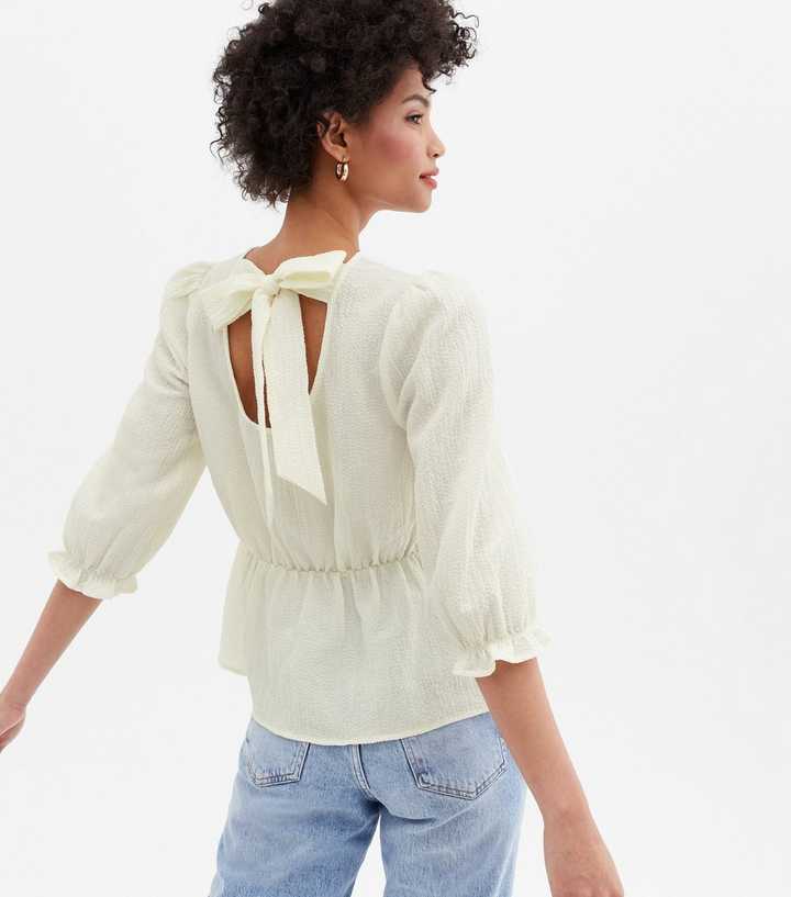 White Textured Tie Back Peplum Blouse