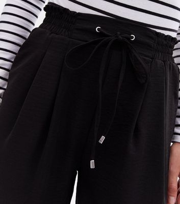 Click to view product details and reviews for Black Shirred High Waist Cuffed Joggers New Look.
