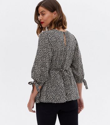 Click to view product details and reviews for Maternity Black Ditsy Floral Tie Sleeve Peplum Top New Look.