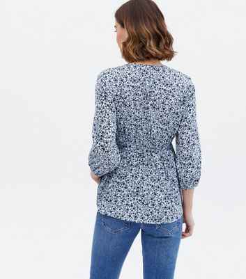 Click to view product details and reviews for Maternity Blue Ditsy Floral Crepe Wrap Blouse New Look.