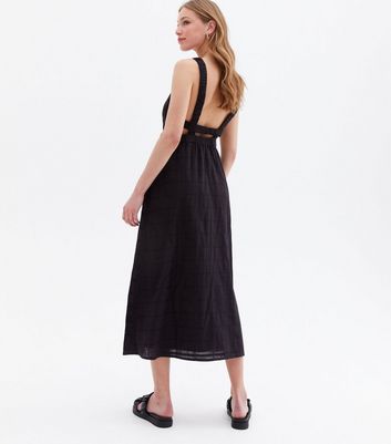 Click to view product details and reviews for Black Cut Out Cross Back Midi Dress New Look.