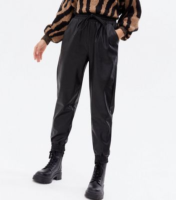 Click to view product details and reviews for Petite Black Leather Look Tie Waist Joggers New Look.
