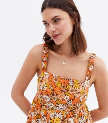 Click to view product details and reviews for Orange Floral Tiered Strappy Mini Dress New Look.