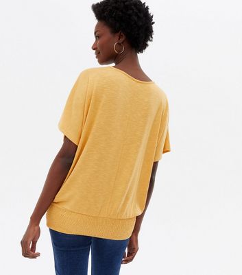 Click to view product details and reviews for Mustard Fine Knit Shirred Hem Batwing Top New Look.