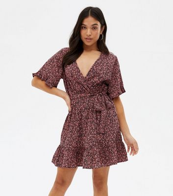 Click to view product details and reviews for Petite Black Ditsy Floral Crepe Mini Wrap Dress New Look.