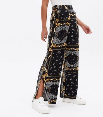 Click to view product details and reviews for Black Chain Split Hem High Waist Trousers New Look.