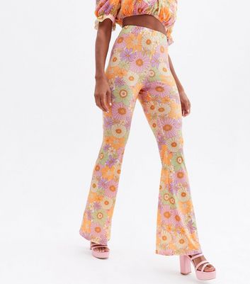 Click to view product details and reviews for Sunflower Power Lilac Floral Flared Trousers New Look.