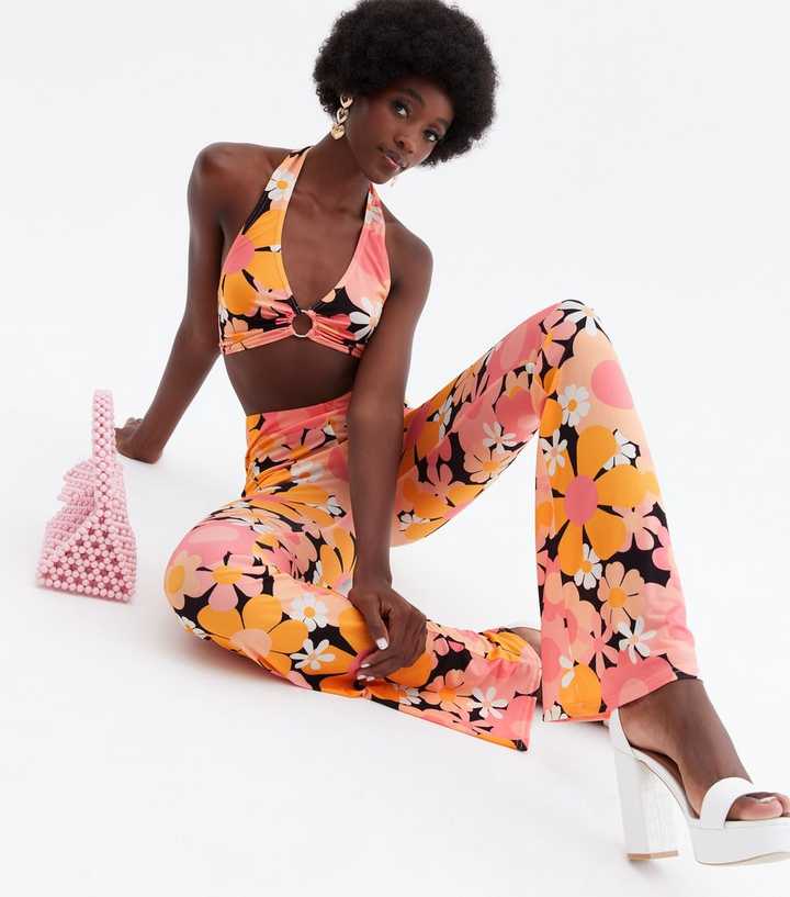 https://media2.newlookassets.com/i/newlook/820427209/womens/clothing/trousers/psychedelic-tall-orange-floral-flared-trousers.jpg?strip=true&qlt=50&w=720