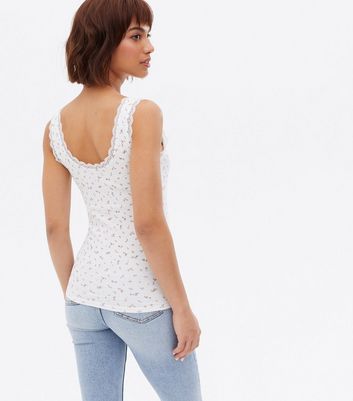 Click to view product details and reviews for White Ditsy Floral Lace Trim Ribbed Vest New Look.